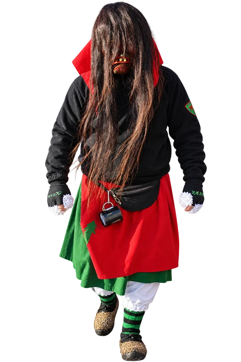Huzler Hexa im traditionellen Häs mit Maske und langen dunklen Haaren.