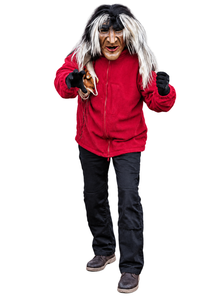 Huzler Male – Dachtler Huzler Hexa Huzler Male mit Maske, rotem Oberteil und dunkler Hose.