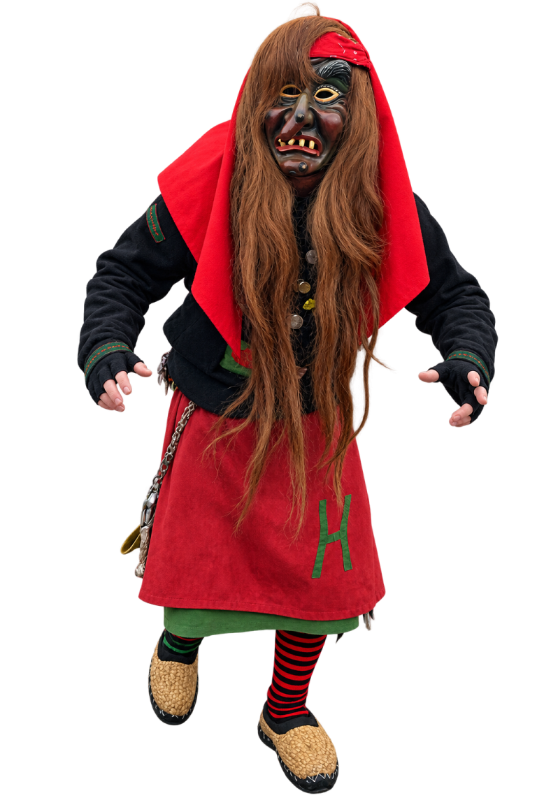 Huzler Hexa im traditionellen Häs Huzler Hexa im traditionellen Häs mit Maske und langen rötlichen Haaren.